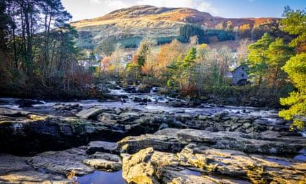 Sunset at the Falls of Dochart, looking across the river to the hills