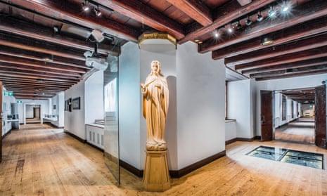 A figurine stands at the entrance to the museum at Monastère des Augustines