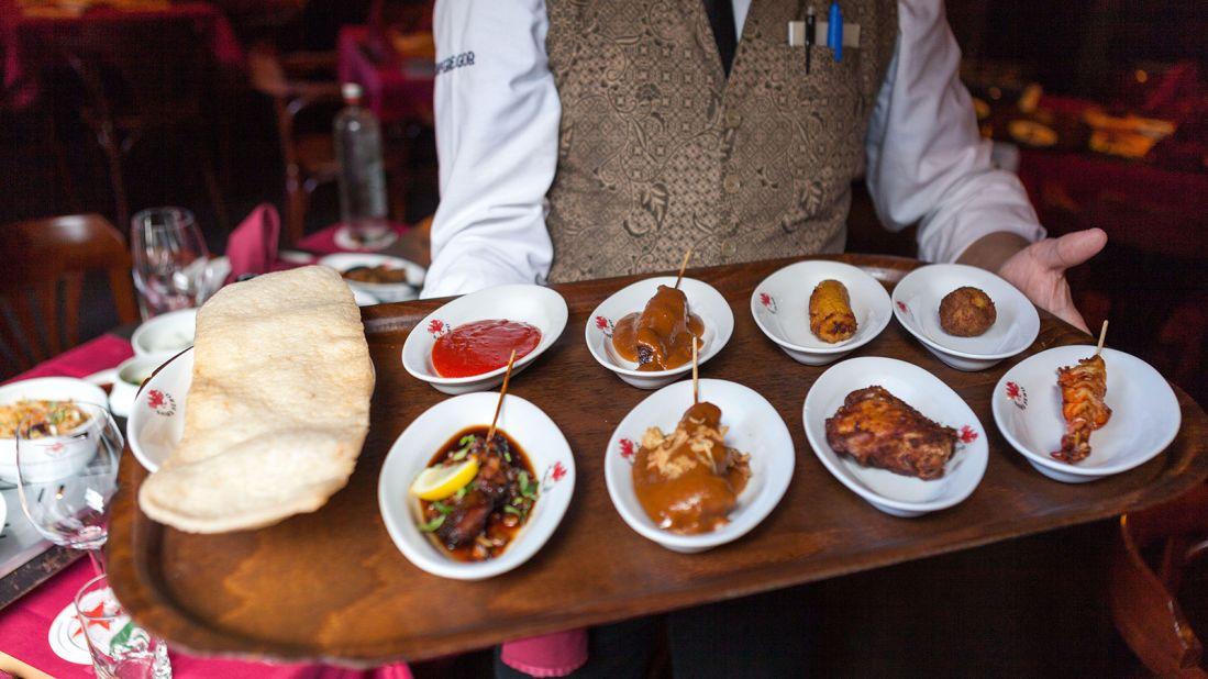 <strong>Rijsttafel: </strong>Rijsttafe (rice table) was first introduced during Dutch colonial rule in Indonesia, when the Europeans would serve small plates of Indonesian dishes -- from sweet to spicy -- to their visitors.